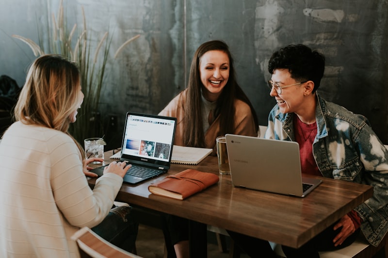 Community college students collaborating on laptop